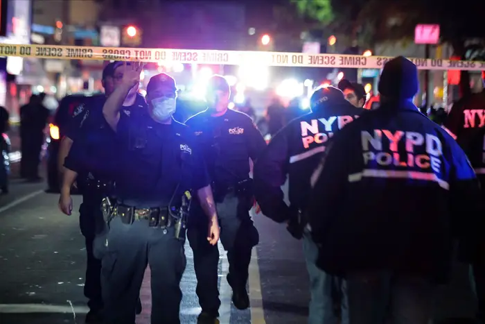 New York City police officers work a scene in Brooklyn on June 4th.